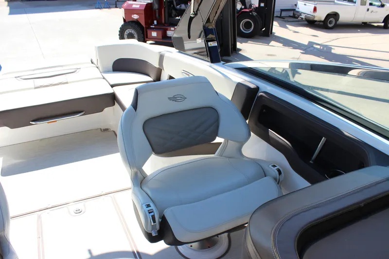 Slide: The Image of 2018 Chaparral 287 SSX boat interior with luxurious seating and modern design. - 16