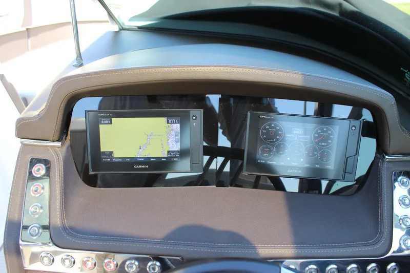 Slide: The Image of Dashboard of 2018 Chaparral 287 SSX boat with dual Garmin displays. - 18