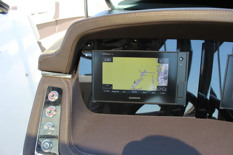 Slide: The Image of Dashboard of 2018 Chaparral 287 SSX with Garmin GPS navigation system. - 19