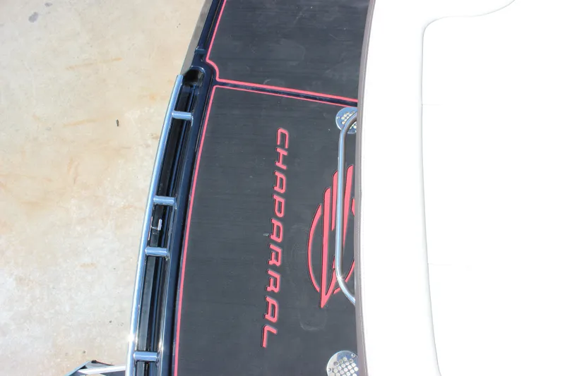 Slide: The Image of 2018 Chaparral 287 SSX boat deck with logo and sleek design elements. - 28