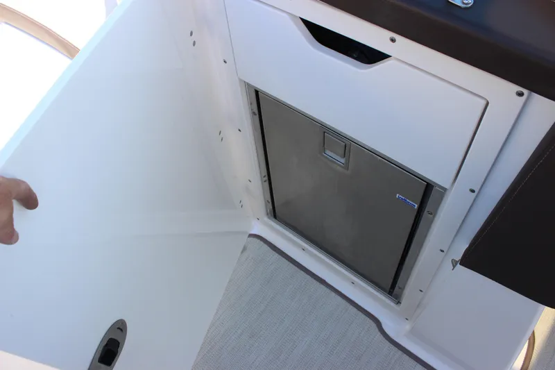 Slide: The Image of 2018 Chaparral 287 SSX boat interior with built-in storage compartment. - 31