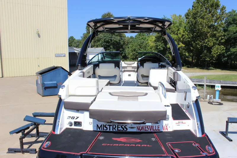 Slide: The Image of 2018 Chaparral 287 SSX boat docked, featuring spacious seating and sleek design. - 5