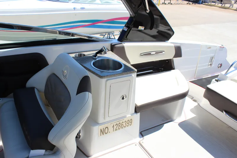 Slide: The Image of 2018 Chaparral 287 SSX boat interior with seating and sink area. - 7