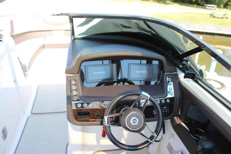 Slide: The Image of 2018 Chaparral 287 SSX boat dashboard with Garmin navigation displays. - 9