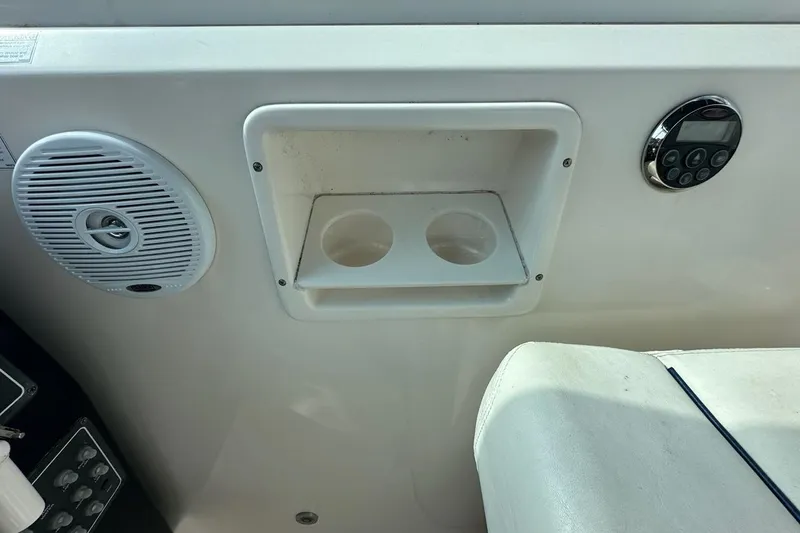 Slide: The Image of 2006 Tiara Yachts 2900 Coronet interior with speaker, control panel, and cup holders. - 20