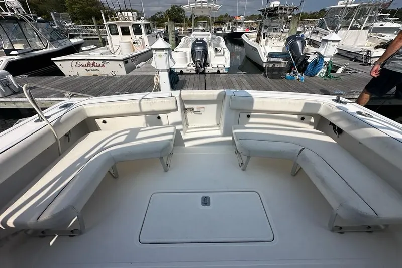 Slide: The Image of 2006 Tiara Yachts 2900 Coronet boat interior with seating, docked at marina. - 25