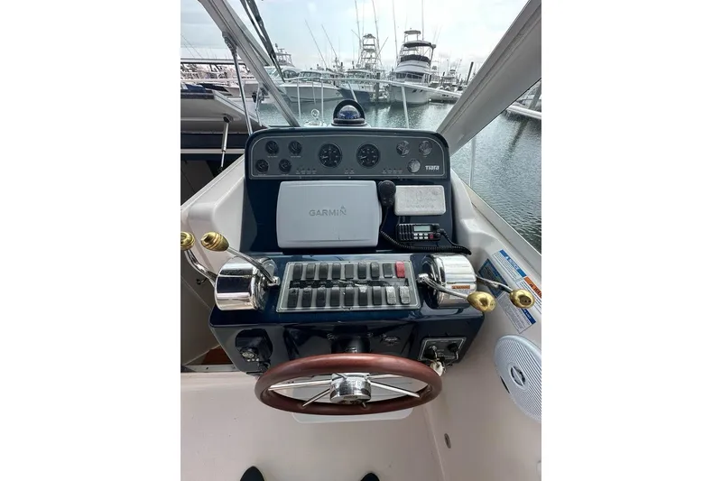 Slide: The Image of 2006 Tiara Yachts 2900 Coronet helm with Garmin navigation, docked at marina. - 6