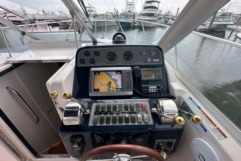 Slide: The Image of Helm of 2006 Tiara Yachts 2900 Coronet with navigation equipment and controls. - 7
