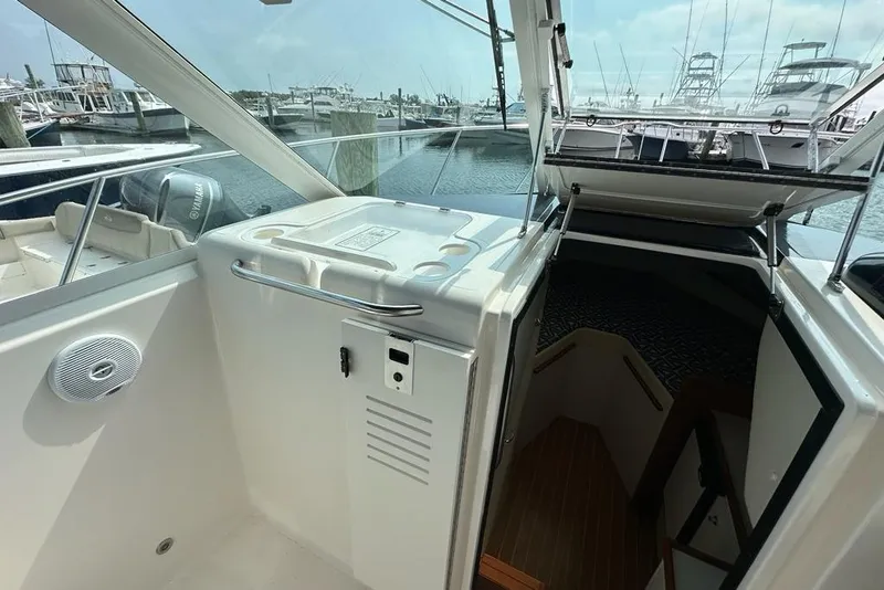 Slide: The Image of 2006 Tiara Yachts 2900 Coronet interior with open cabin door, docked at marina. - 9