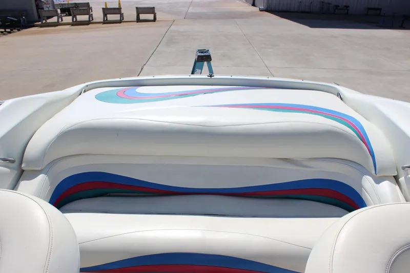 Slide: The Image of 1995 Baja 272 boat interior with colorful upholstery design. - 14
