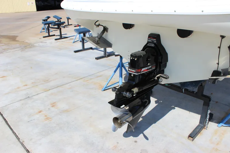Slide: The Image of 1995 Baja 272 boat with Mercury outboard motor on a concrete surface. - 5