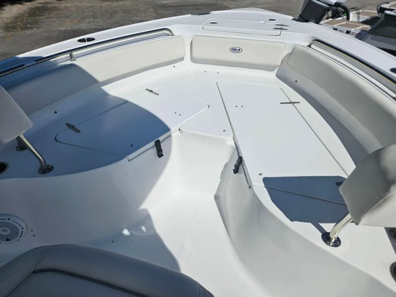 Slide: The Image of 2026 Sea Hunt Ultra 234 boat interior with spacious seating and sleek design. - 15