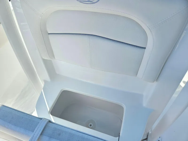 Slide: The Image of 2026 Sea Hunt Ultra 234 boat interior with storage compartment. - 17