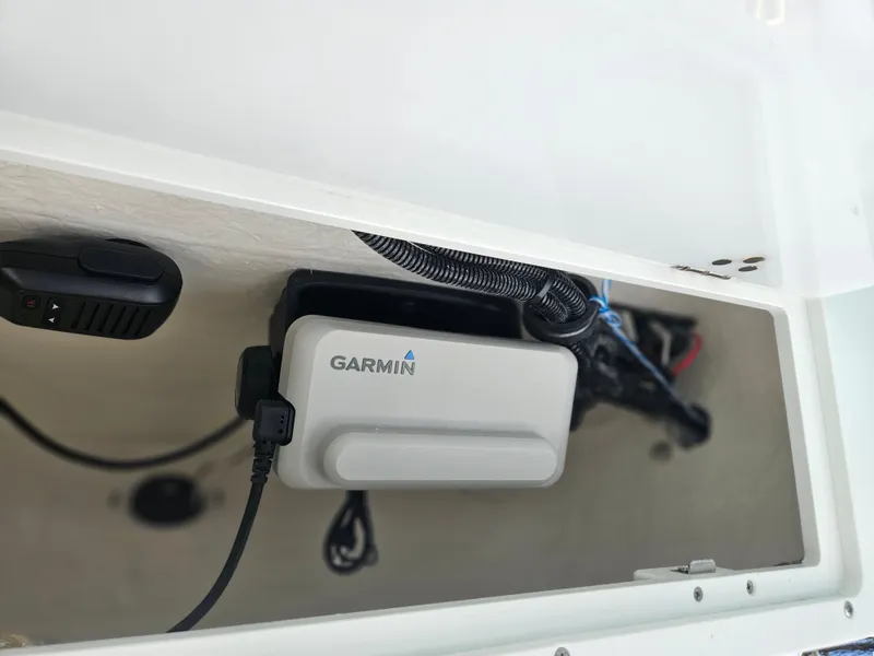 Slide: The Image of Garmin device installed in 2026 Sea Hunt Ultra 234 boat compartment. - 24