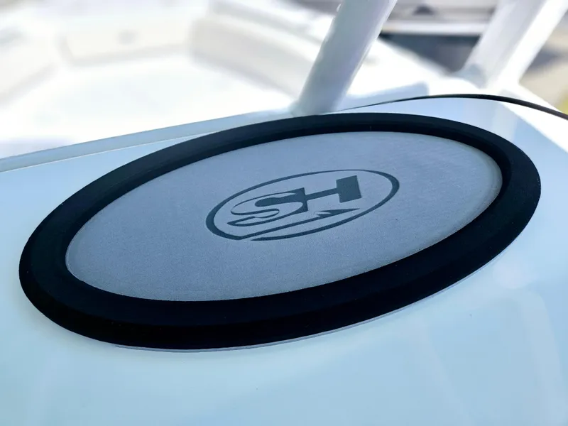 Slide: The Image of 2026 Sea Hunt Ultra 234 boat logo on a sleek white surface. - 30