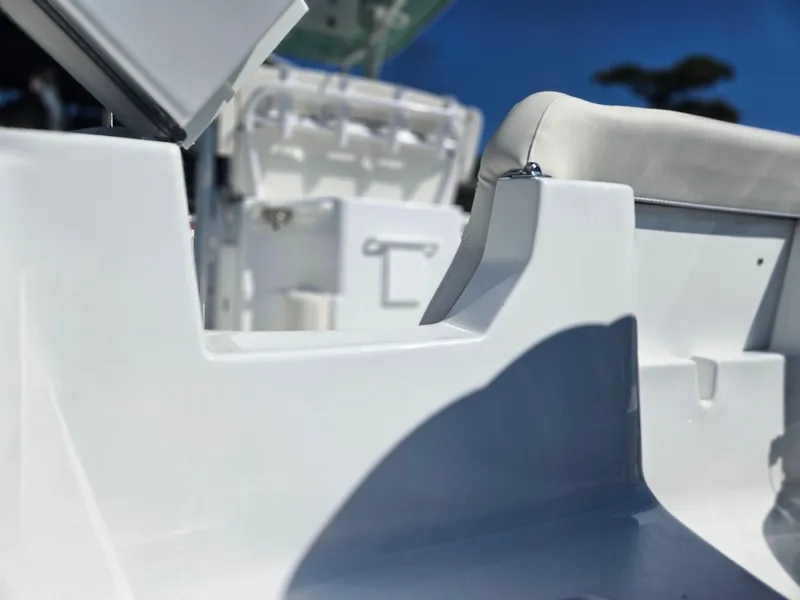 Slide: The Image of 2026 Sea Hunt Ultra 234 boat interior with white seating and sleek design. - 13