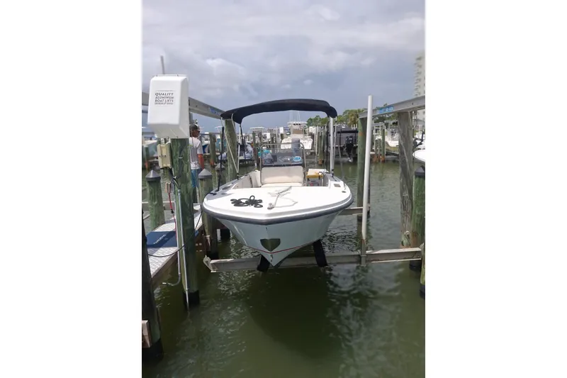 Slide: The Image of 1989 Mako 171 Center Console boat docked at marina, overcast sky. - 3