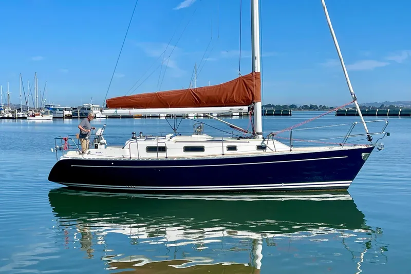 The Image of Sailboat Freedom 35, 1995 model, docked in calm marina waters. - 0