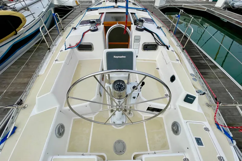 Slide: The Image of Cockpit of 1995 Freedom 35 sailboat with steering wheel and navigation equipment. - 10