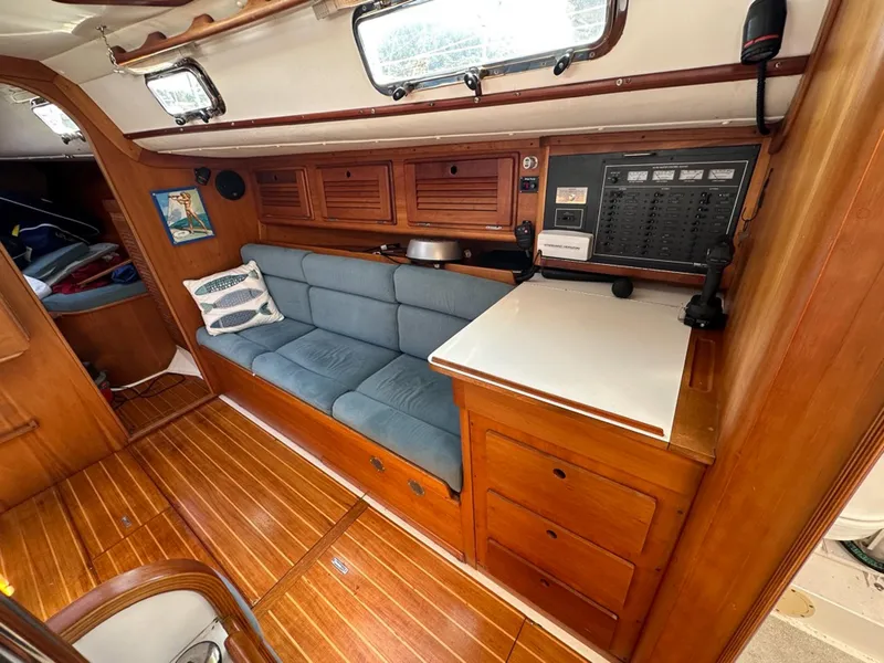 Slide: The Image of Interior of a 1995 Freedom 35 yacht with blue couch. - 18