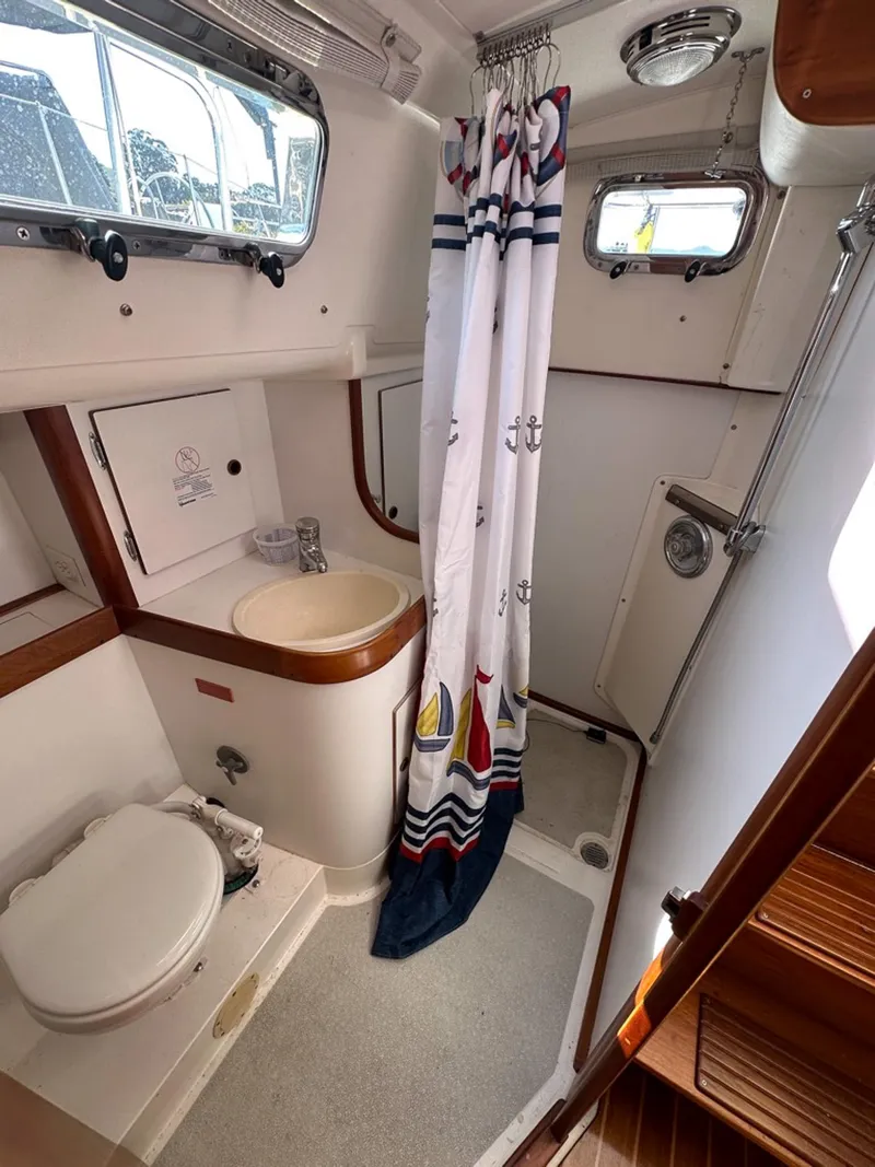 Slide: The Image of Interior view of 1995 Freedom 35 boat bathroom with shower. - 29