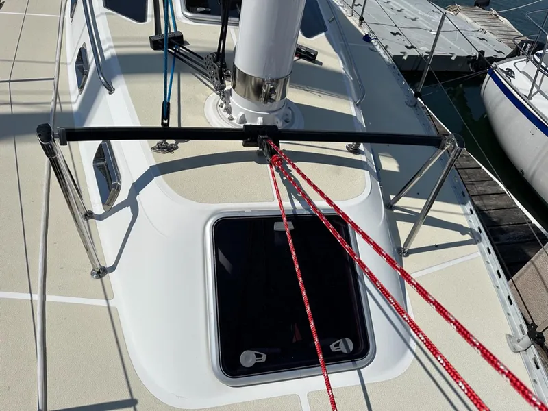 Slide: The Image of Deck of a 1995 Freedom 35 sailboat with red ropes. - 38