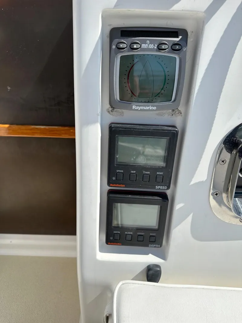 Slide: The Image of Navigation instruments on a 1995 Freedom 35 boat. - 41