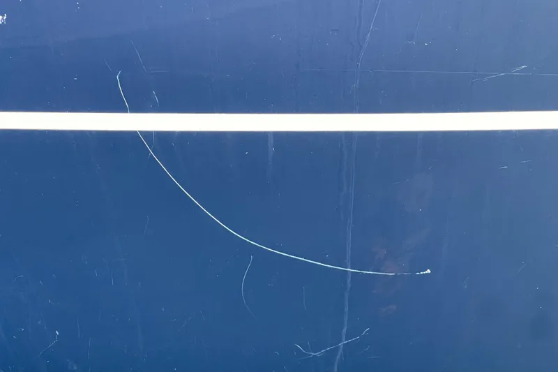 Slide: The Image of Blue surface with white stripe and scratches, Freedom 35, 1995 model. - 49