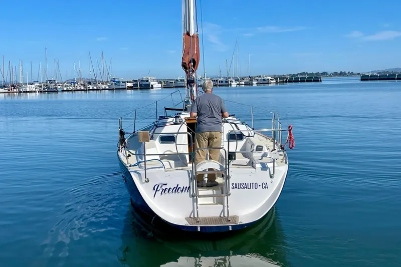 Slide: The Image of Sailboat "Freedom 35" from 1995 in Sausalito harbor, clear blue sky. - 7