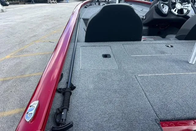 Slide: The Image of 2022 Tracker Pro Team 190 TX Tournament Edition boat, red exterior, spacious deck, steering console visible. - 21