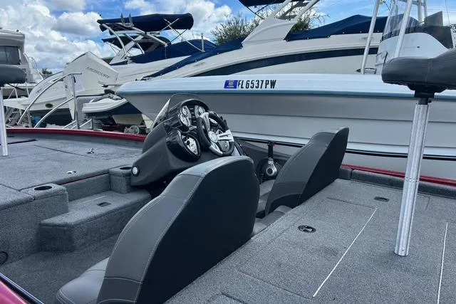 Slide: The Image of 2022 Tracker Pro Team 190 TX Tournament Edition boat interior with steering console and seating. - 24