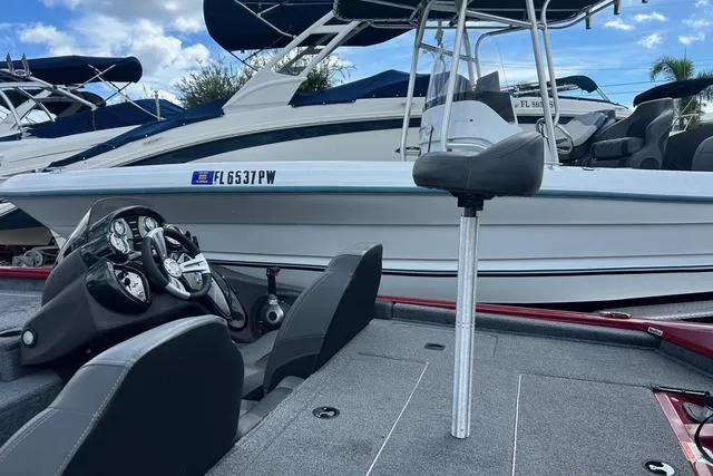 Slide: The Image of 2022 Tracker Pro Team 190 TX Tournament Edition boat interior with steering console and seating. - 25
