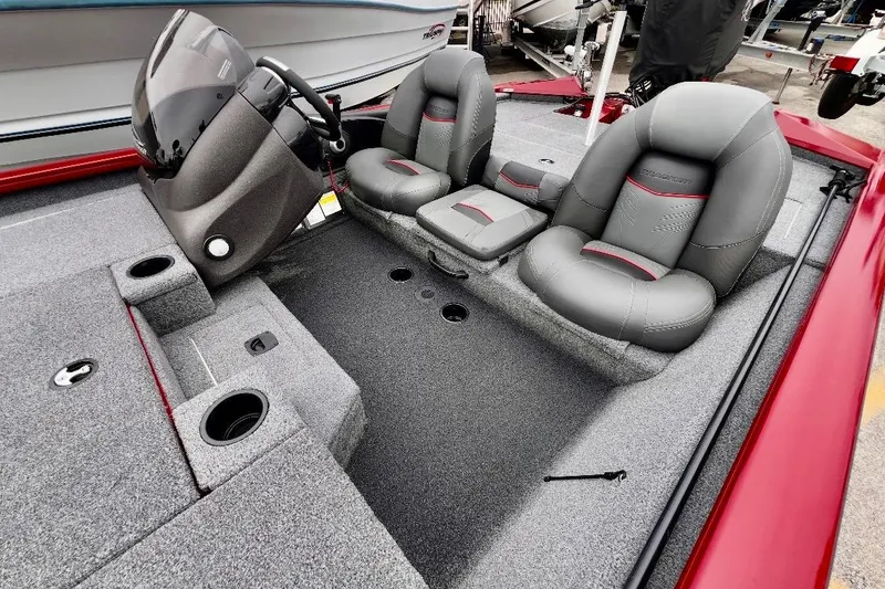 Slide: The Image of 2022 Tracker Pro Team 190 TX Tournament Edition boat interior with gray seats and steering console. - 8