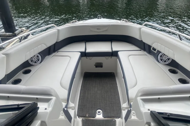 Slide: The Image of 2015 Chaparral 307 SSX boat interior with spacious seating and cup holders. - 4