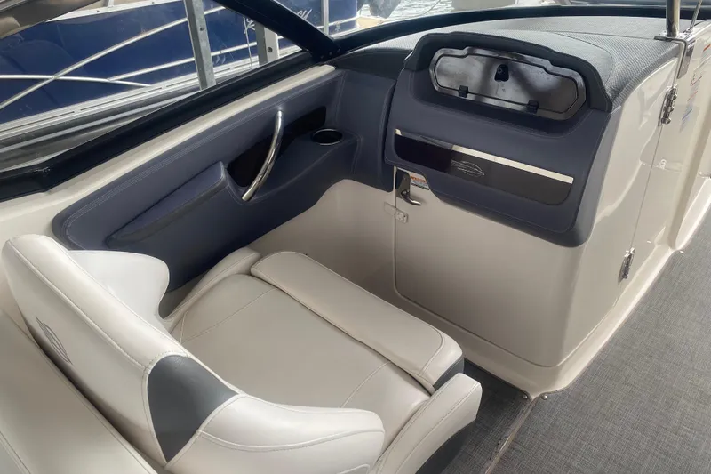 Slide: The Image of 2015 Chaparral 307 SSX boat interior with sleek seating and modern dashboard design. - 6