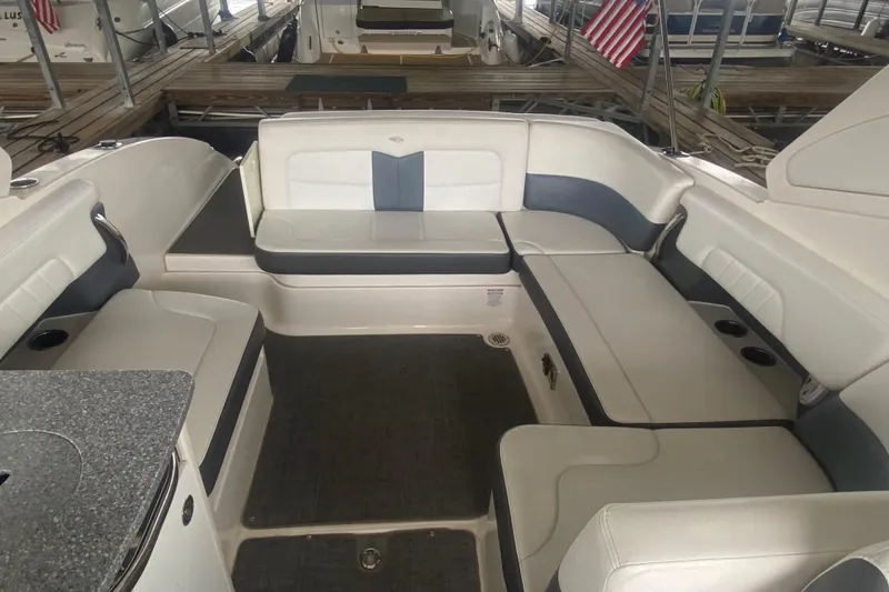 Slide: The Image of 2015 Chaparral 307 SSX boat interior with spacious seating and modern design. - 9