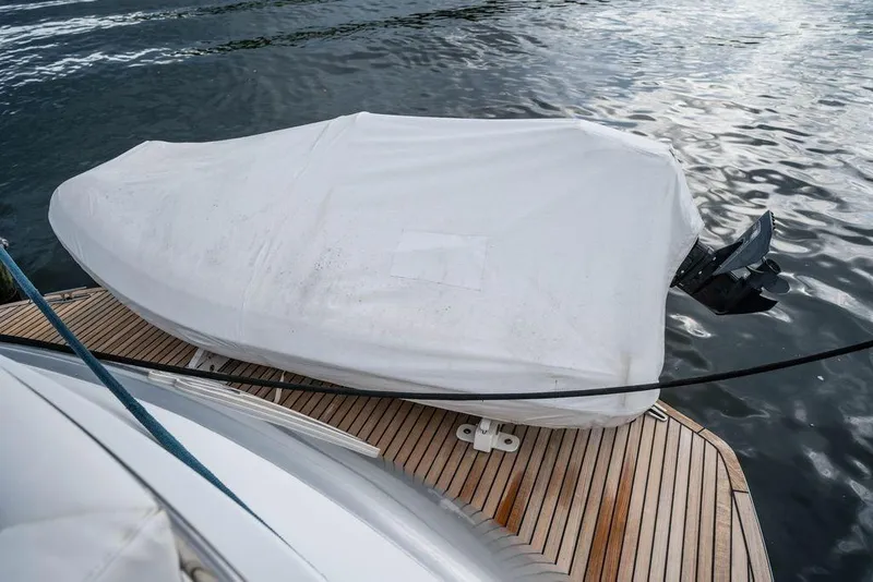 Slide: The Image of Covered boat on Pershing 62' yacht deck, 2007 model, near water. - 12