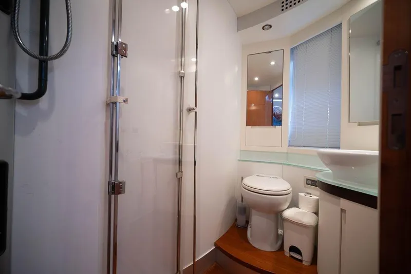 Slide: The Image of Luxurious bathroom in 2007 Pershing 62' yacht with modern fixtures and glass shower. - 23