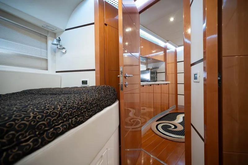 Slide: The Image of Luxurious interior of 2007 Pershing 62' yacht featuring elegant wood finishes and modern design. - 28