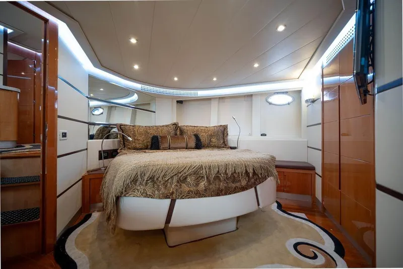 Slide: The Image of Luxurious bedroom interior of 2007 Pershing 62' yacht with elegant decor and ambient lighting. - 37