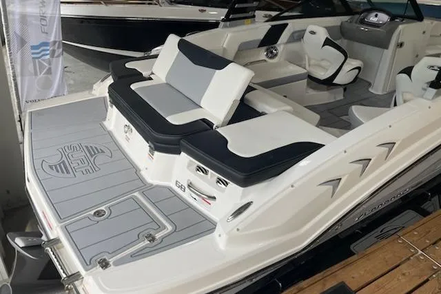 Slide: The Image of 2025 Chaparral 23 Surf boat with sleek design and comfortable seating. - 2