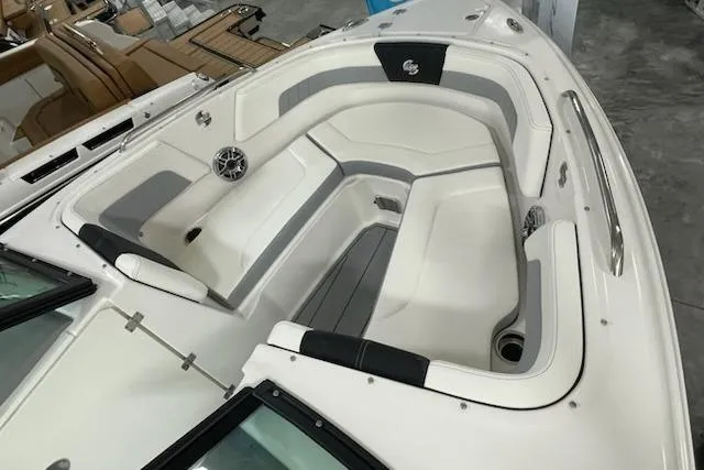 Slide: The Image of 2025 Chaparral 23 Surf boat interior with white and gray seating, modern design. - 5