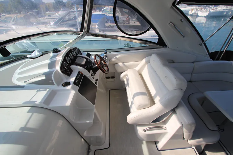 Slide: The Image of 2008 Crownline 340 CR boat interior with helm, seating, and dashboard. - 20
