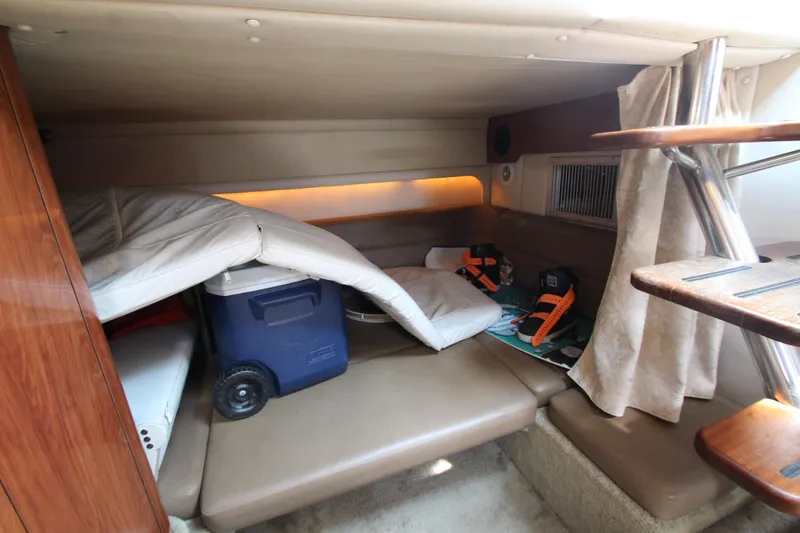 Slide: The Image of 2008 Crownline 340 CR cabin interior with seating, cooler, and life jackets. - 36