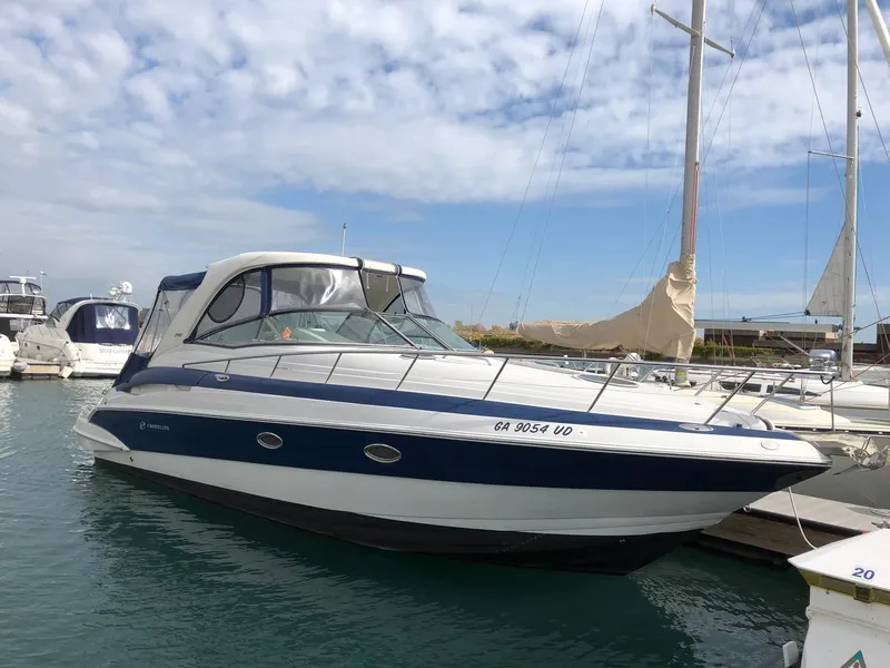 Slide: The Image of 2008 Crownline 340 CR boat docked in marina under partly cloudy sky. - 5
