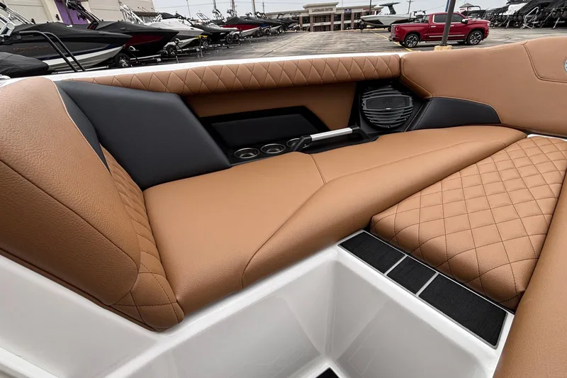 Slide: The Image of 2026 Tigé Z5 boat interior with tan quilted seats and modern design. - 22