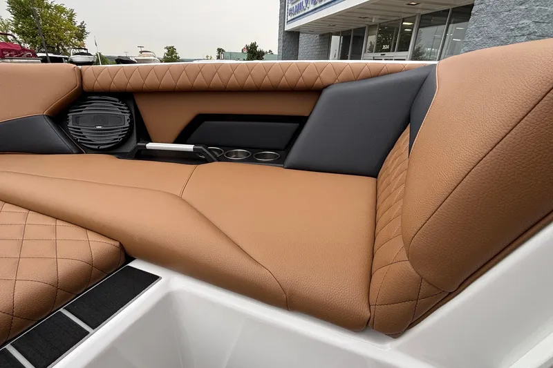 Slide: The Image of 2026 Tigé Z5 boat interior with tan quilted leather seats and built-in speakers. - 24
