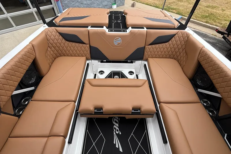 Slide: The Image of Luxurious interior of 2026 Tigé Z5 boat with tan quilted seating and modern design. - 32