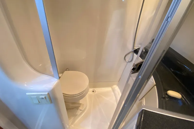Slide: The Image of 2004 Carver 36 Super Sport bathroom with shower and toilet. - 28