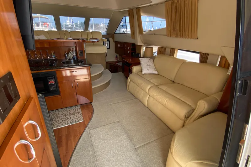 Slide: The Image of Luxurious interior of 2004 Carver 36 Super Sport yacht with beige leather seating. - 4